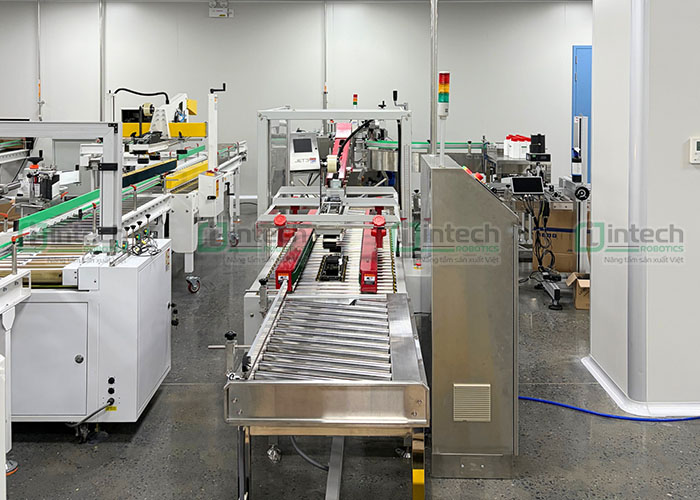 Lợi ích khi cho hệ thống băng tải thông minh & máy dán thùng tự động & Trạm robot đi vào vận hành